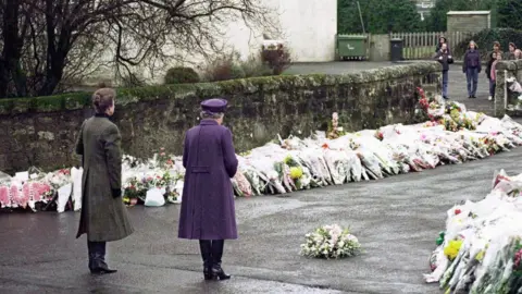 EPA The Queen and Princess Anne at Dunblane Primary School, where 16 children and their teacher were killed by a gunman