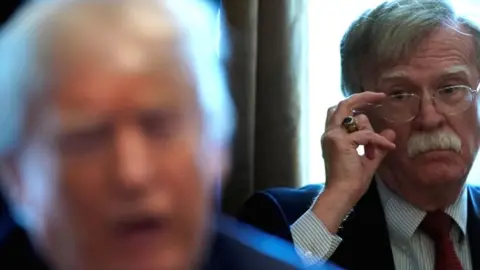Reuters John Bolton (R) and Donald Trump