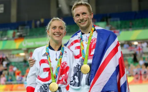PA/David Davies Laura Trott and Jason Kenny with medals