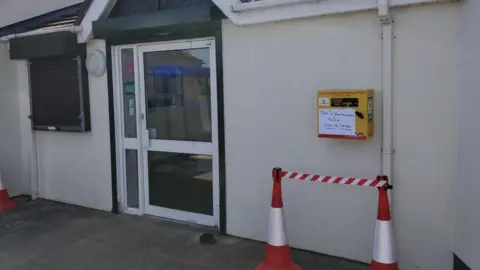 Charlie Heaven Damaged Defibrillator outside club