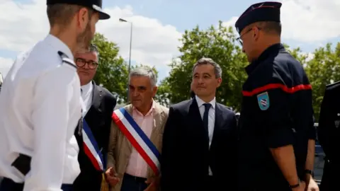 Reuters Gérald Darmanin visiting police headquarters outside Paris, Tuesday 7 July