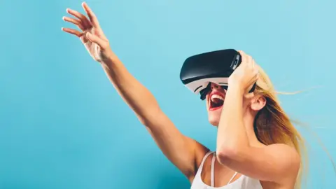 Getty Images Woman wearing VR headset