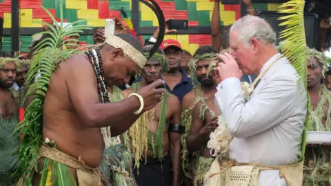 Getty Images Prince Charles tried kava while dressed in traditional clothing during a visit to the neighbouring island of Vanuatu earlier this year