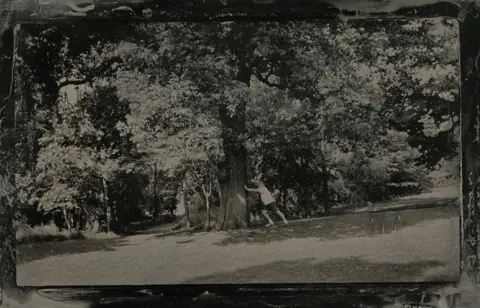 Jo de Banzie Playing under a tree