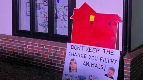 Family photo Home Alone Christmas light display