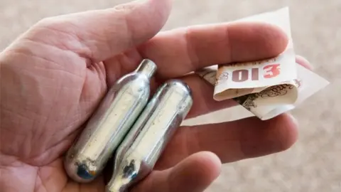 Getty Images Two canisters of nitrous oxide