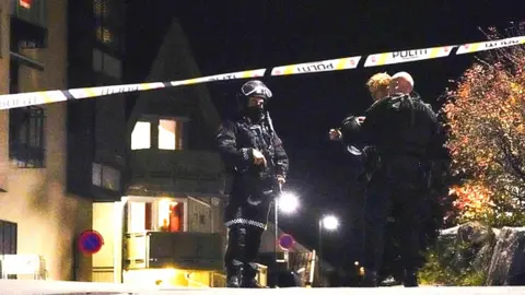 Getty Images Police officers cordon off the scene where they are investigating in Kongsberg