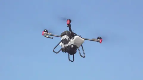 An industrial drone in the sky.