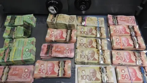 Royal Canadian Mounted Police Piles of cash