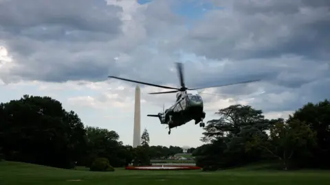 Getty Images Mr Biden's helicopter departs Washington