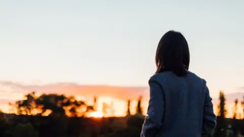 Getty Images Stock image of a woman in silhouette