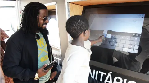 Community tablet Dayn Amade and boy