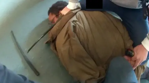 Metropolitan Police Body worn footage of officer arresting Ali Harbi Ali while he is detained on the ground