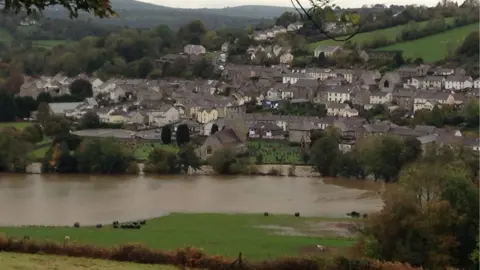 Chris Gillibrand Swollen river at Llandysul, looking towards the community with the river in the foreground