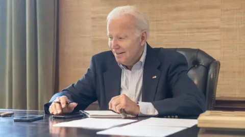 White House President Joe Biden pictured at his desk in the White House on Thursday