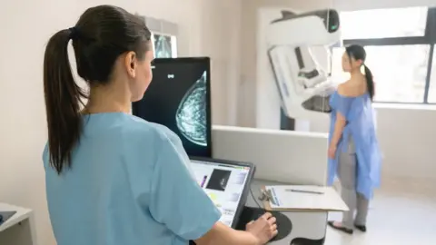 Getty Images A woman having a mammogram