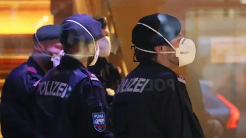 AFP Police wearing masks at a hotel in Innsbruck, Austria