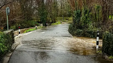 Water on the road a Garnswllt area near Ammanford