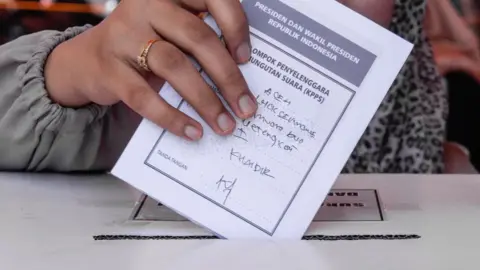 Getty Images A woman seen casting her ballot during pre-election drill, April 17 2019