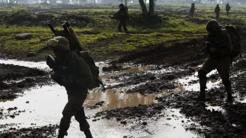 AFP Israeli soldiers from the Golani Brigade take part in a military training exercise in the Israeli-annexed Golan Heights near the border with Syria on 19 January 2015.