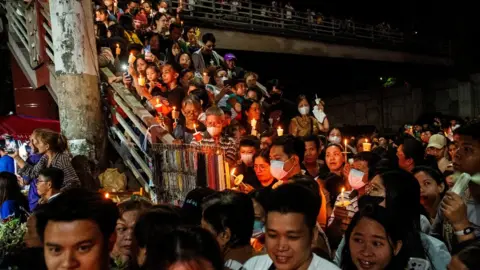 Reuters Crowds gather on stairs for a traditional procession in the Philippines