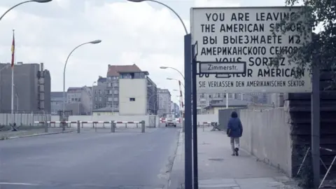 A man exits the American sector in Berlin 1973