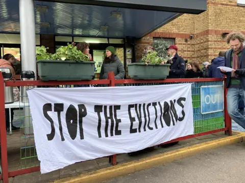 BBC Protesters gather outside the hotel on Thursday morning