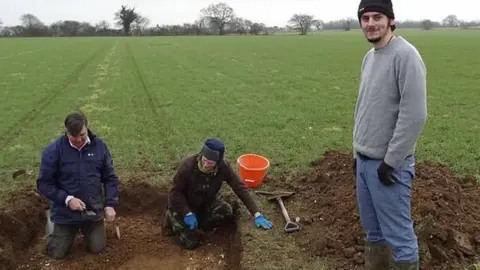 John Rainer Tom Lucking at the dig site in