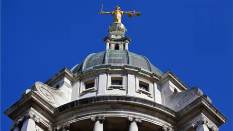 Getty Chris Dorney Lady Justice statue on top of the Old Bailey building