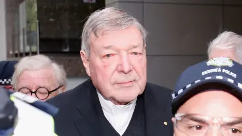 Getty Images Cardinal George Pell attends a Melbourne court hearing in October