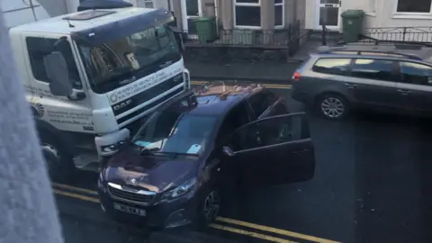 Dylan Jones A truck colliding with a car on the A487