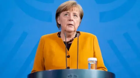 Getty Images Chancellor Merkel giving statement on Easter U-turn, 24 Mar 21