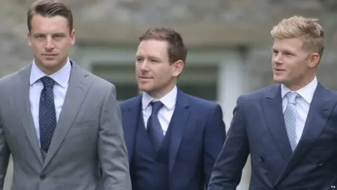 PA England cricket players Jos Buttler (left), Eoin Morgan (centre) and Sam Billings (right) arrive at St Mary the Virgin, East Brent.