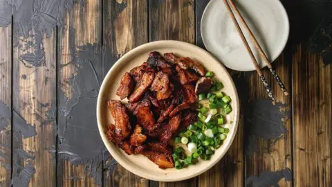 Getty Images Stir fried pork