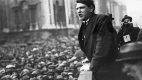 Getty/Hulton Archive/ Indepedent News and Media Michael Collins addressing an election rally