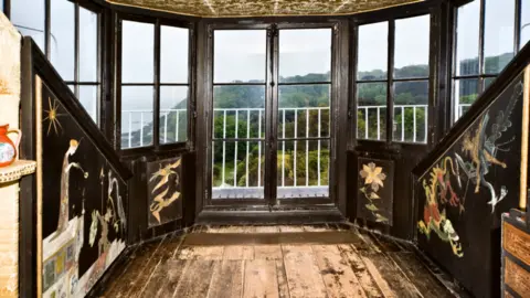 Visit Guernsey Victor Hugo's bedroom at Hauteville House, overlooking St Peter Port