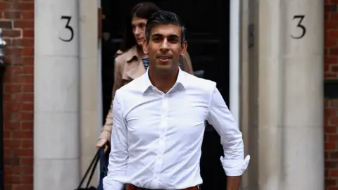 Reuters Rishi Sunak leaves his campaign headquarters on Sunday