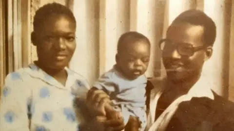 Ferdinand Omondi Mother and father with child