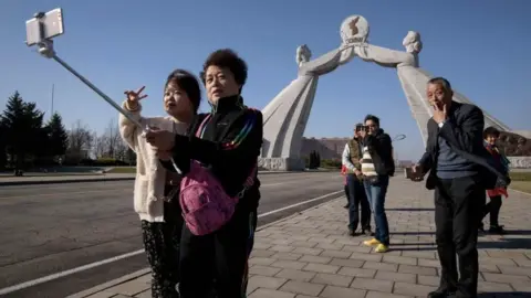 AFP via Getty Chinese tourists in Pyongyang in April 2019 - before the outbreak