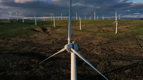 Daniel Leal/AFP Wind turbines in field in UK