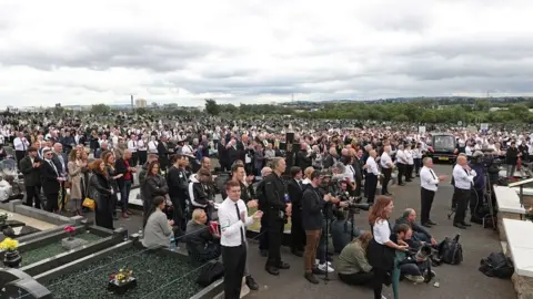 PA Media A large crowd also attended the cemetery