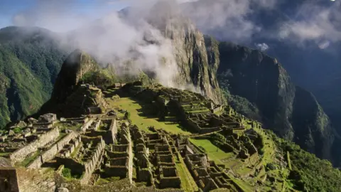 Science Photo Library The Inca city of Machu Picchu sits high in the Andes mountains