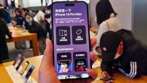 Getty Images Customers at Apple's flagship store in Shanghai, China.