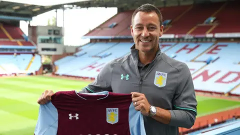 Getty Images John Terry signs for Aston Villa