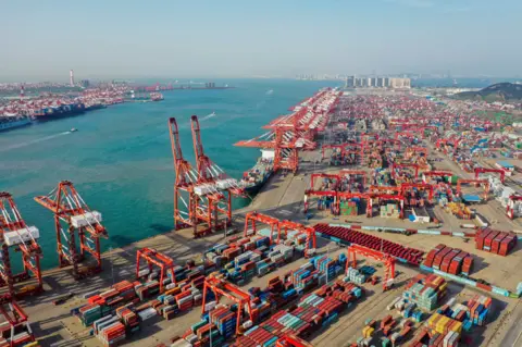 Getty Images Aerial view of containers sitting stacked at Qingdao Port on 28 May, 2019 in Qingdao