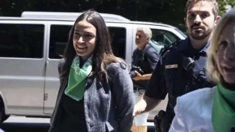 Congresswoman Alexandria Ocasio-Cortez is detained outside the Supreme Court