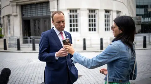 Getty Images Matt Hancock with Gina Coladangelo outside BBC