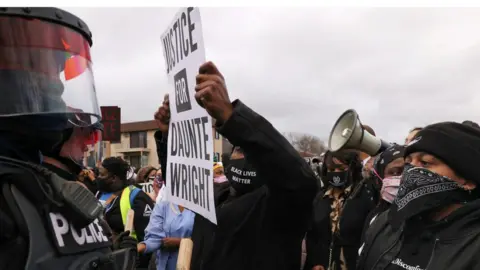 Reuters Protesters rally outside Brooklyn Center Police Department a day after Daunte Wright was shot and killed by a police officer, in Brooklyn Center, Minnesota