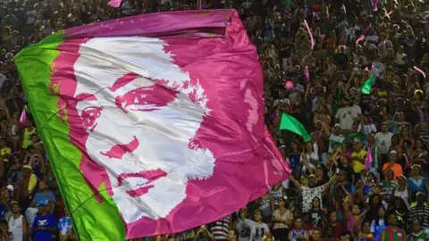 AFP A flag depicting the image of murdered councillor Marielle Franco is seen during the second night of Rio's Carnival parade at the Sambadrome in Rio de Janeiro, on March 5, 2019