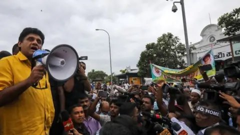 Reuters Sri Lanka's opposition leader Sajith Premadasa talks to supporters in Colombo. Photo: June 2022